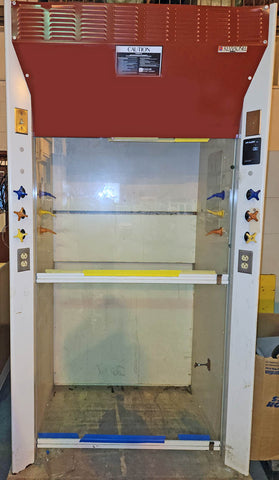 A 4 foot walk in fume hood for sale, Kewaunee Supreme Air, with a red vertical sash, clear glass panel, and control switches on the front.