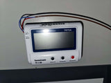 Digital temperature controller with wires on a white background. Thermo Scientific pre-owned –86°C ULT freezer, 19 cu. ft, Model TSX40086D60, 208–230V